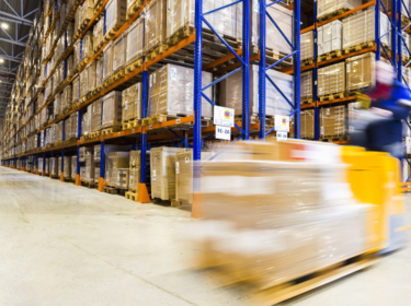 Blurred forklift in warehouse